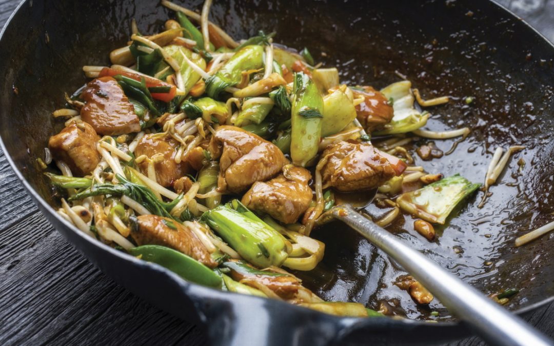 How do cooking and cleaning impact the air quality in our homes?